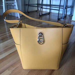Authentic Michael Kors squash colored handbag